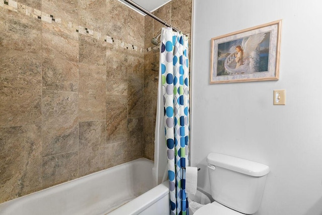 full bath with toilet and shower / bath combo