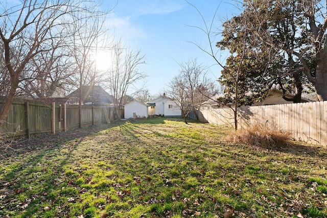 view of yard with a fenced backyard