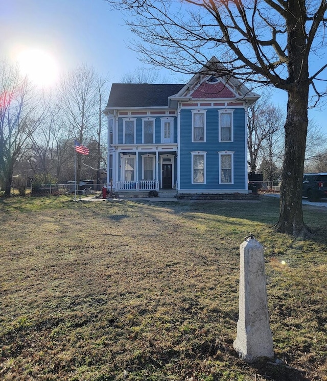 victorian home featuring a front yard