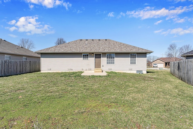 rear view of house featuring fence, a lawn, and entry steps