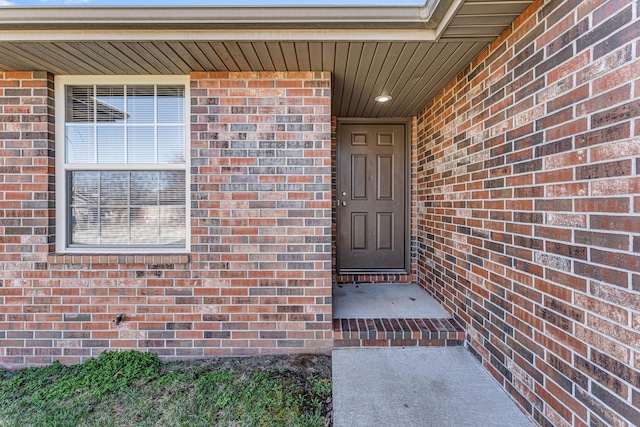 entrance to property with brick siding