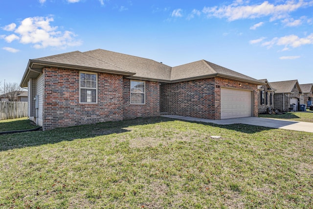 ranch-style home with brick siding, concrete driveway, a garage, and a front yard