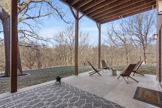 view of patio / terrace with a view of trees