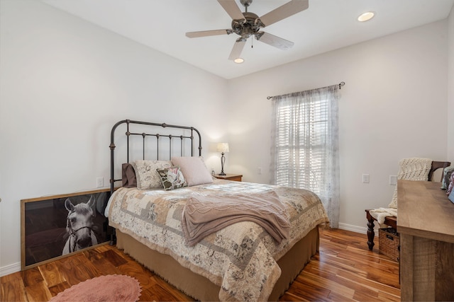 bedroom with recessed lighting, baseboards, wood finished floors, and ceiling fan