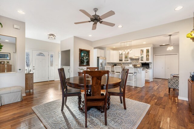 dining space with recessed lighting, a ceiling fan, baseboards, and dark wood-style flooring