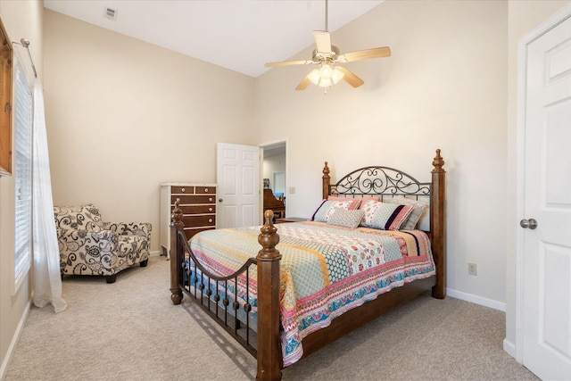 carpeted bedroom featuring visible vents, ceiling fan, baseboards, and lofted ceiling