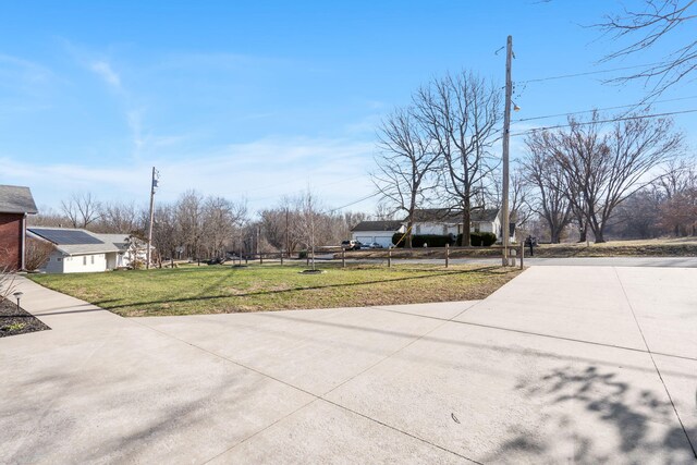 exterior space featuring concrete driveway