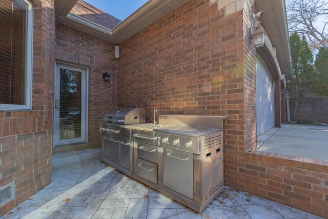 view of patio featuring a sink and area for grilling