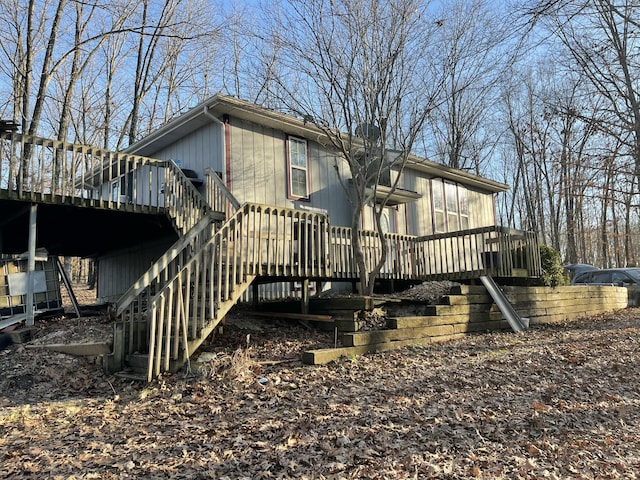 exterior space featuring stairs and a deck