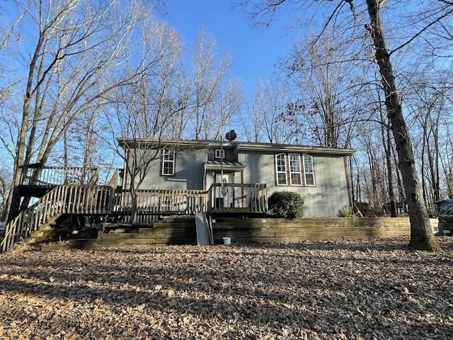 view of front of home featuring a wooden deck and stairs