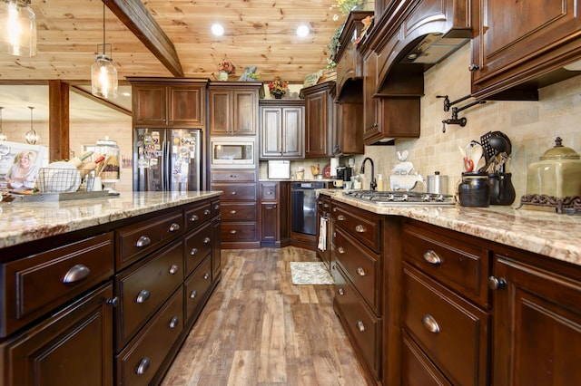 kitchen featuring wood finished floors, appliances with stainless steel finishes, pendant lighting, wooden ceiling, and backsplash