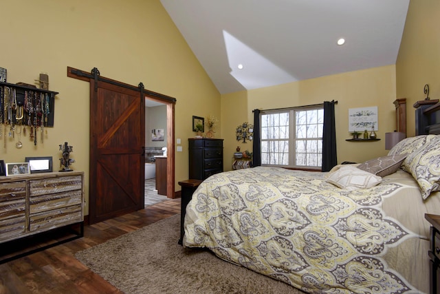 bedroom featuring wood finished floors, high vaulted ceiling, ensuite bath, recessed lighting, and a barn door