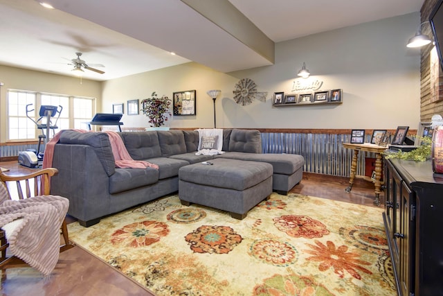 living area with ceiling fan and wood finished floors