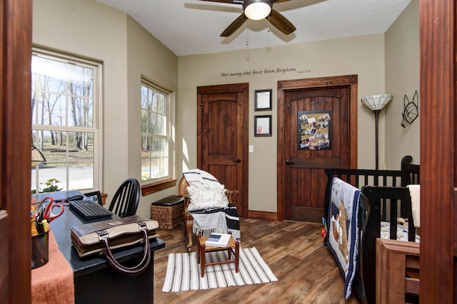 sitting room with ceiling fan and wood finished floors