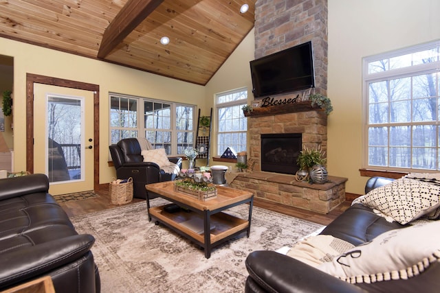 living room with a stone fireplace, wooden ceiling, high vaulted ceiling, and wood finished floors