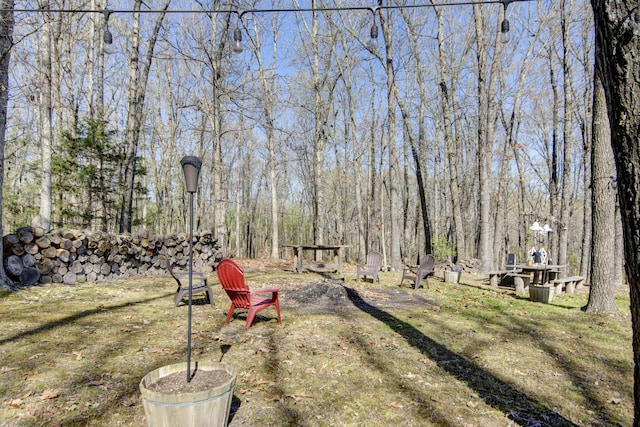 view of yard with a view of trees