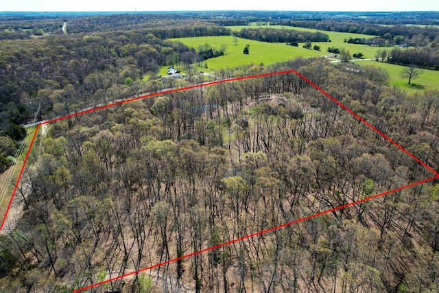 aerial view featuring a rural view and a view of trees