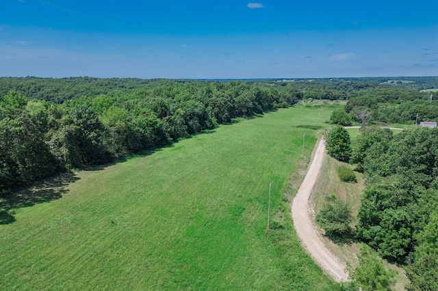 bird's eye view with a rural view and a view of trees