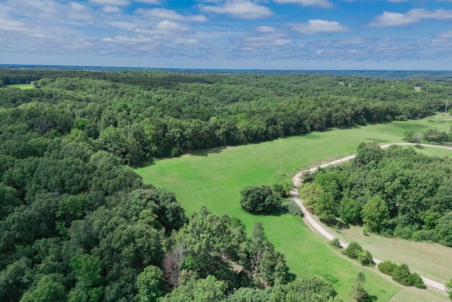 aerial view featuring a wooded view