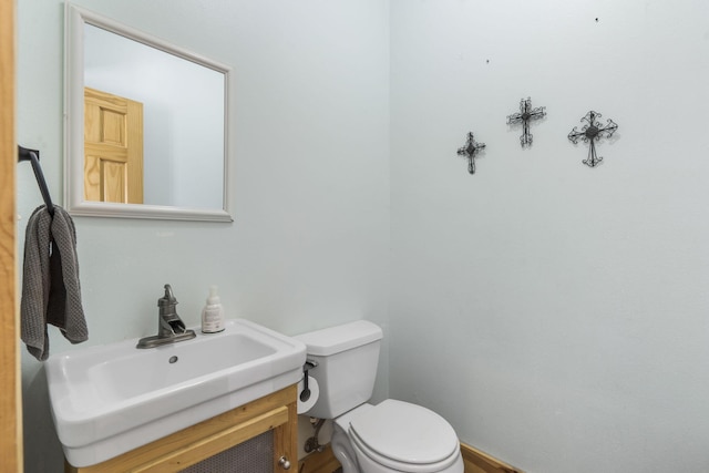 bathroom with toilet and vanity