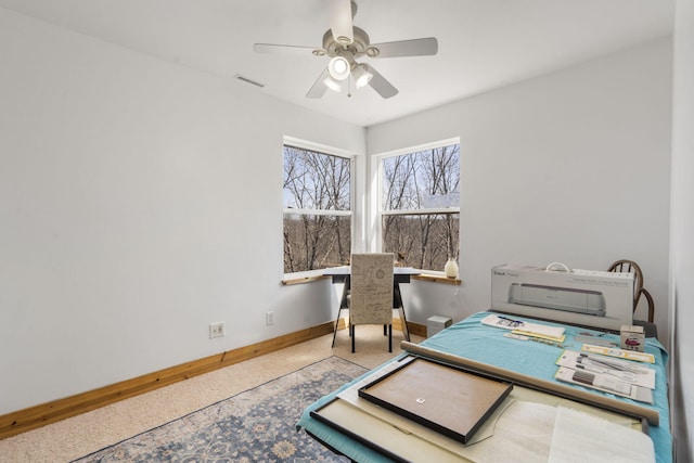 home office with visible vents, baseboards, and a ceiling fan