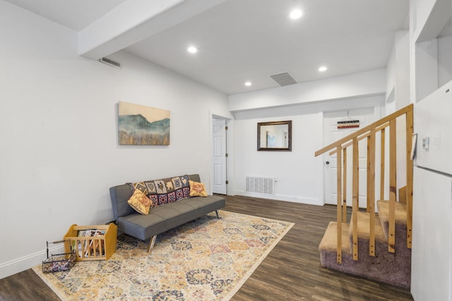 living room with recessed lighting, visible vents, wood finished floors, and stairway