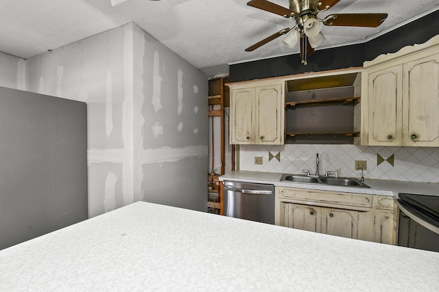 kitchen featuring a ceiling fan, a sink, tasteful backsplash, stainless steel dishwasher, and light countertops