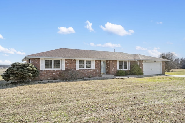 ranch-style house with brick siding, a front lawn, a garage, and a shingled roof