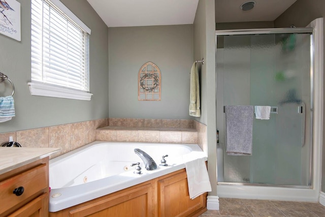 full bath with tile patterned floors, a shower stall, vanity, and a whirlpool tub