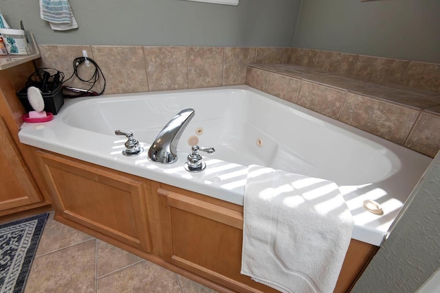 full bath with tile patterned floors and a jetted tub