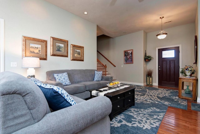 living room featuring visible vents, wood finished floors, recessed lighting, stairway, and baseboards