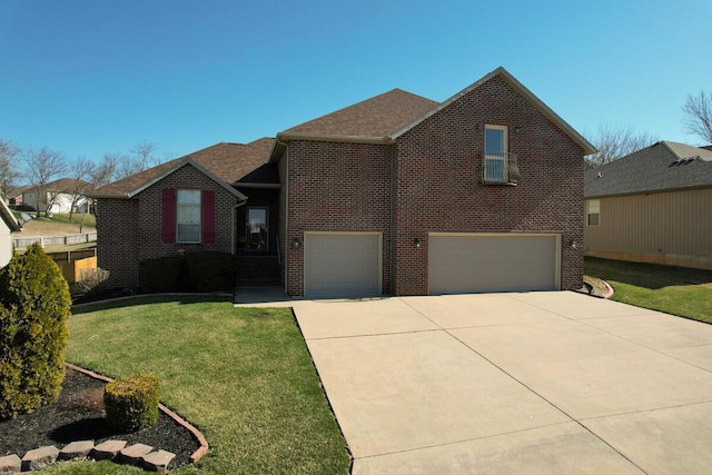 view of front of house with driveway, roof with shingles, a front yard, a garage, and brick siding