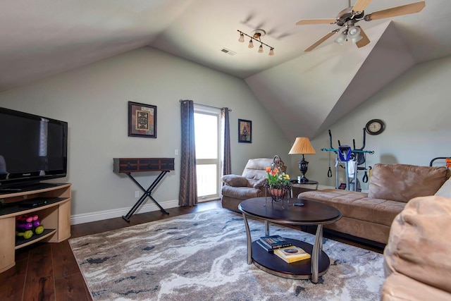 living area with visible vents, ceiling fan, baseboards, lofted ceiling, and wood finished floors