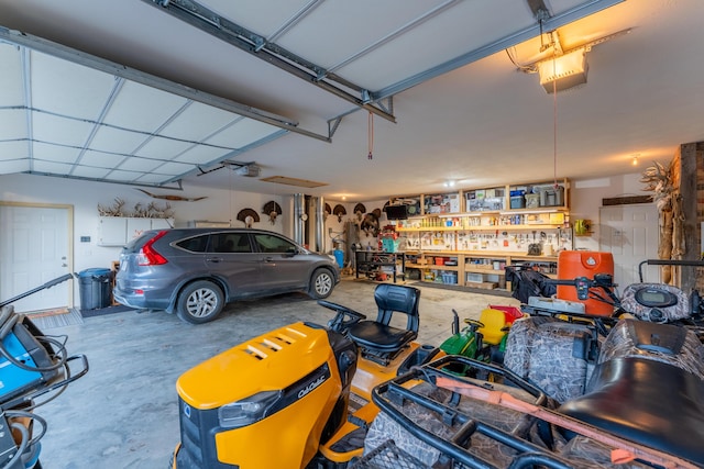 garage with a workshop area and a garage door opener