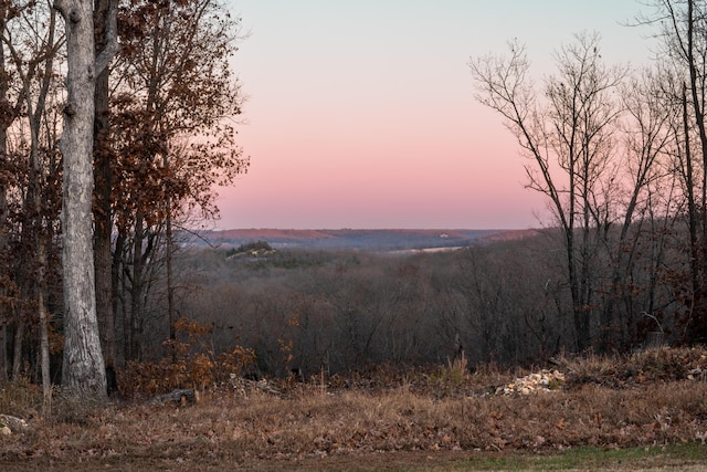 view of landscape with a view of trees