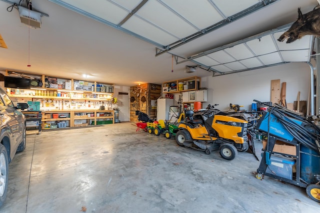 garage featuring a workshop area and a garage door opener