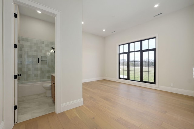 full bath with wood finished floors, visible vents, baseboards, recessed lighting, and shower / bathing tub combination