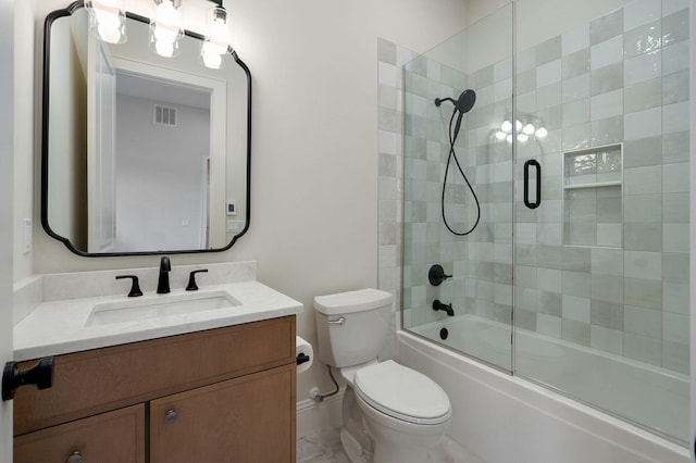 full bath featuring combined bath / shower with glass door, toilet, vanity, and visible vents