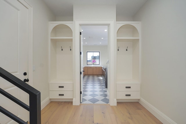 mudroom with recessed lighting, baseboards, and light wood-style floors