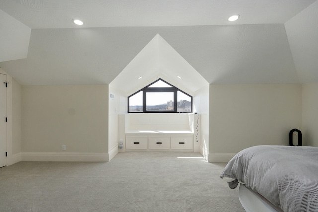 bedroom with recessed lighting, light colored carpet, baseboards, and vaulted ceiling