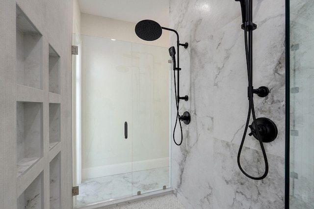 full bathroom with a marble finish shower