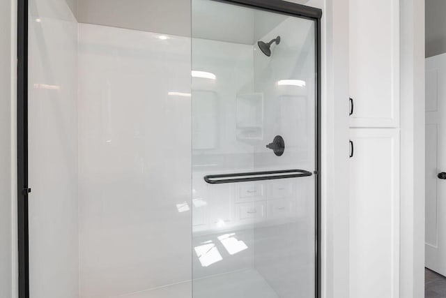 bathroom featuring a shower stall