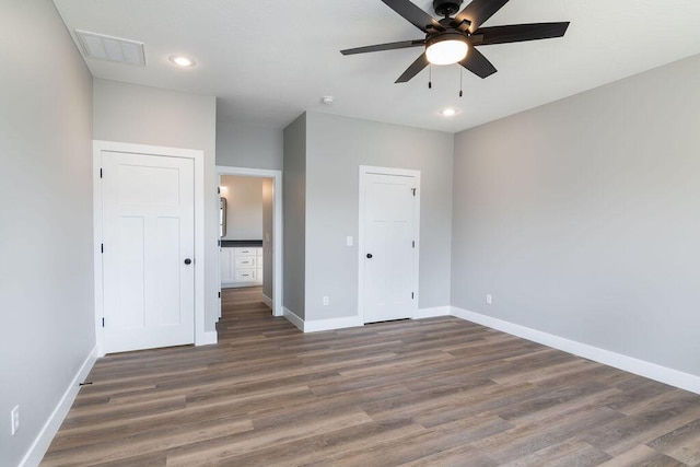 unfurnished bedroom with recessed lighting, ceiling fan, baseboards, and wood finished floors