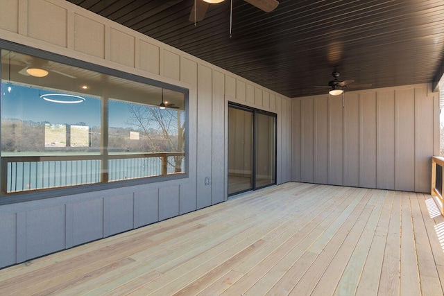 wooden terrace featuring ceiling fan