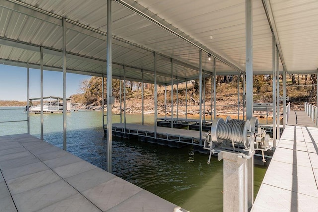 dock area featuring a water view and boat lift