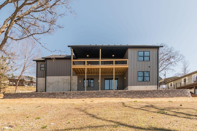 rear view of property with board and batten siding