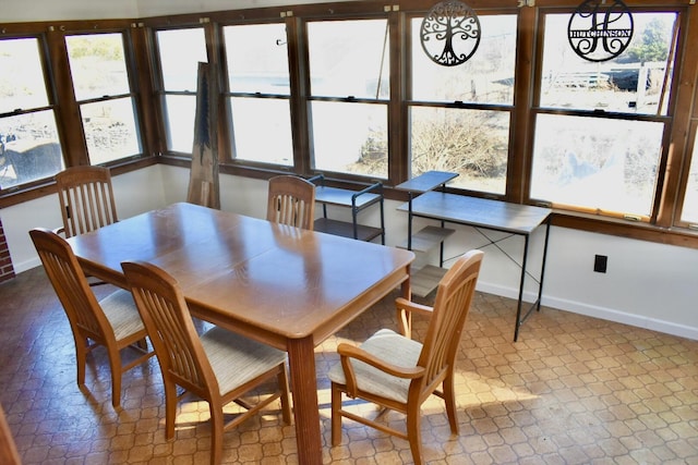 dining area with tile patterned floors and baseboards