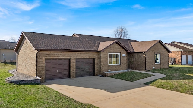 ranch-style house with concrete driveway, a front yard, a shingled roof, a garage, and brick siding