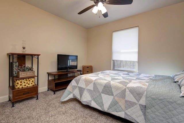 carpeted bedroom with baseboards and ceiling fan