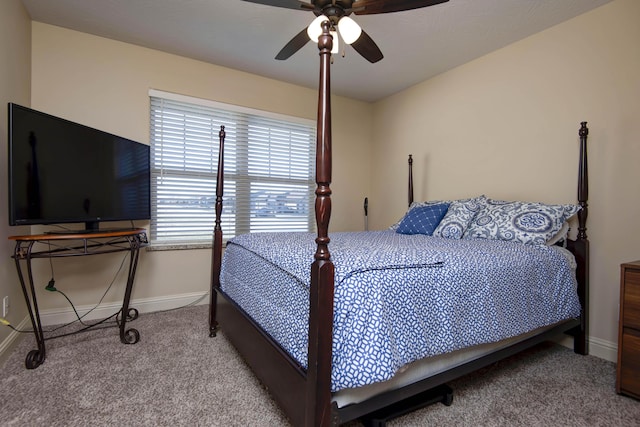 bedroom with baseboards, carpet floors, and a ceiling fan